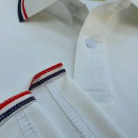 Chi tiết sản phẩm áo cổ trụ polo bo sọc cá sấu lạnh poly thấm hút màu trắng
