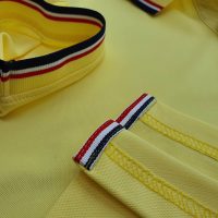 Chi tiết sản phẩm áo cổ trụ polo bo sọc cá sấu lạnh poly thấm hút màu vàng