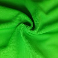 Hình chụp cận cảnh chất vải áo polo bo trơn cá sấu mè unisex xanh lá