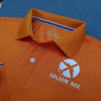 Đồng phục áo thun polo bo trơn màu cam thêu logo