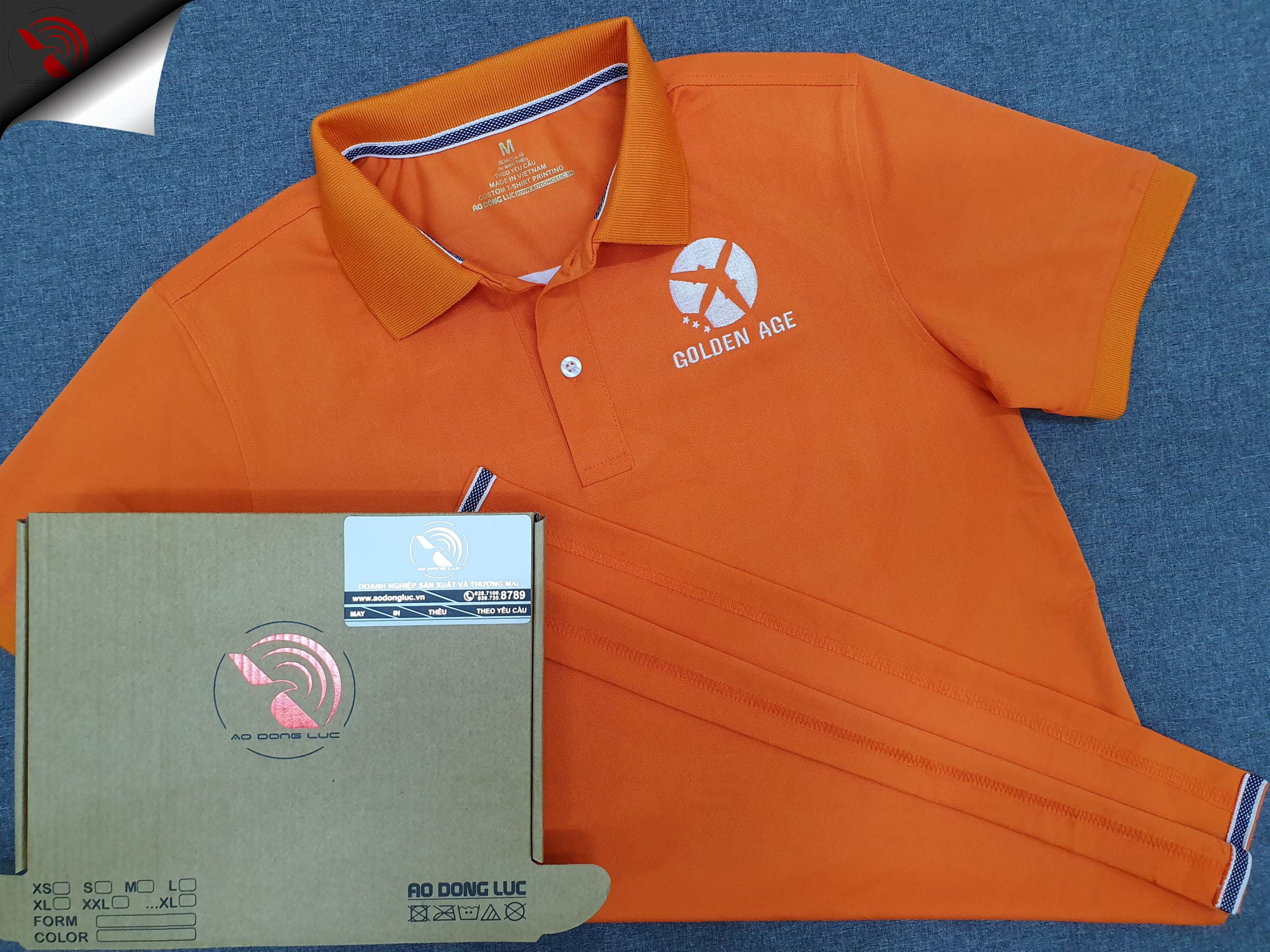 Đồng phục áo thun polo bo trơn màu cam thêu logo