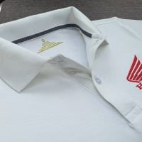 Đồng phục áo thun polo bo trơn màu trắng thêu logo