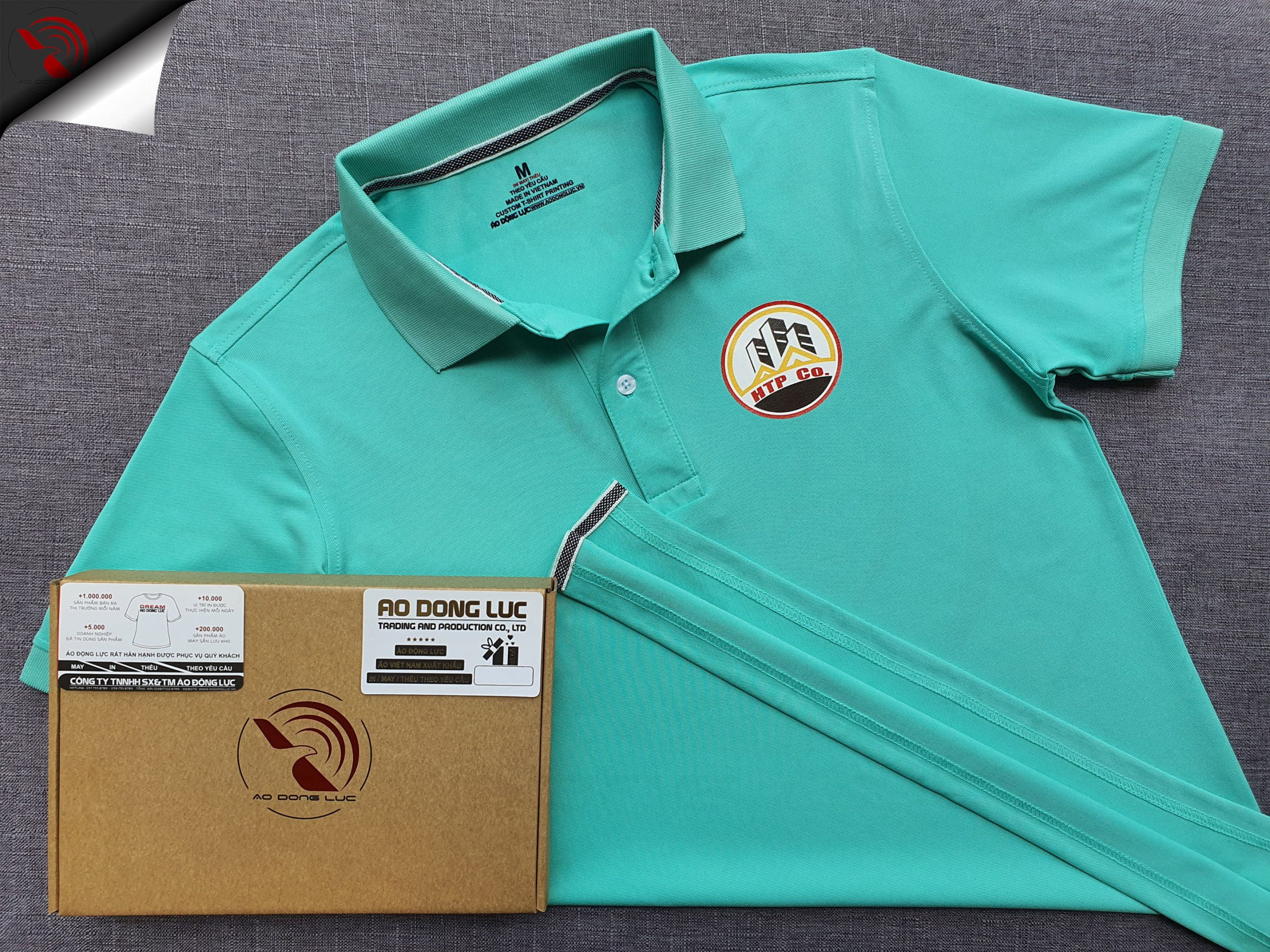Đồng phục áo thun polo bo trơn xanh ngọc in decal logo